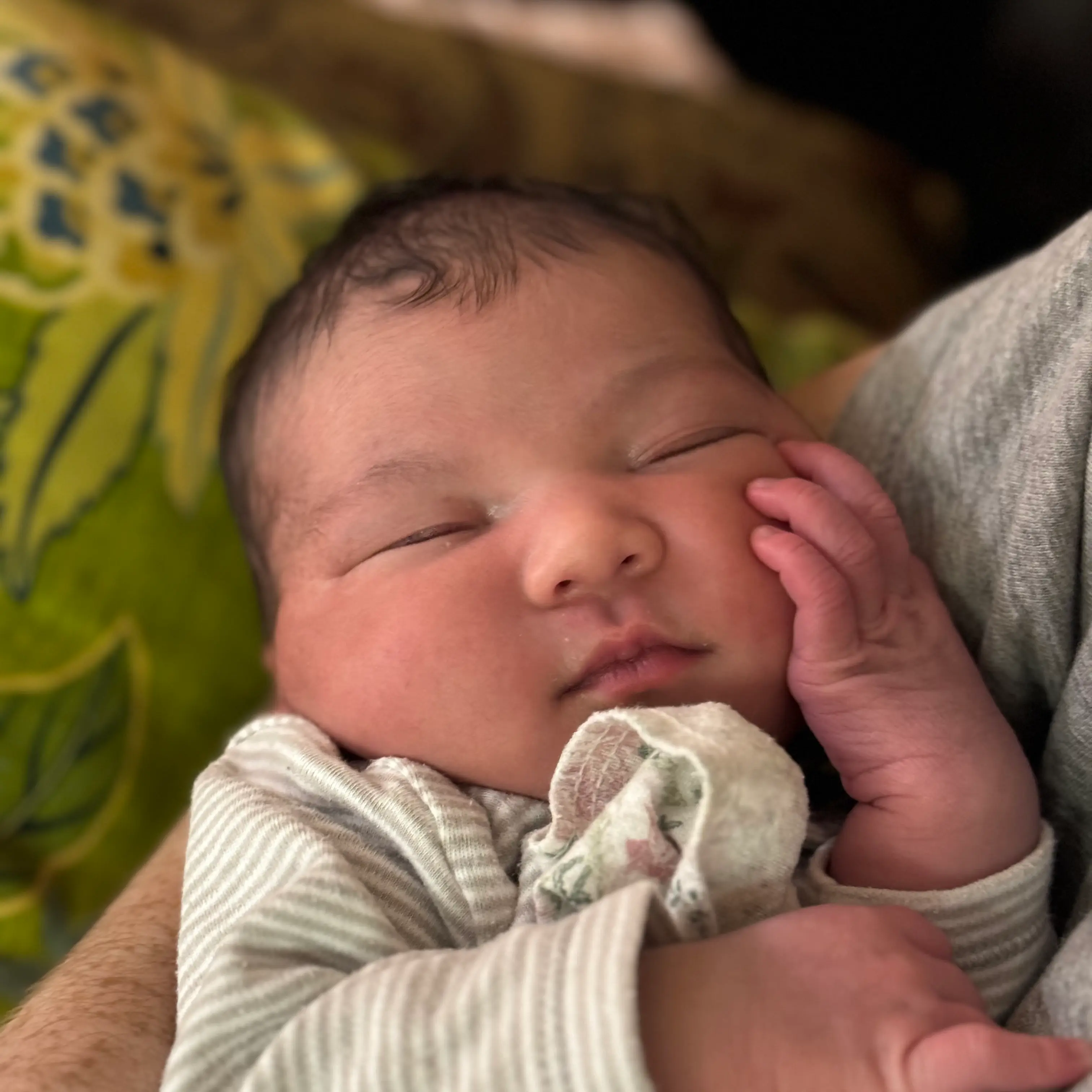 Braden holding his newborn daughter Emily